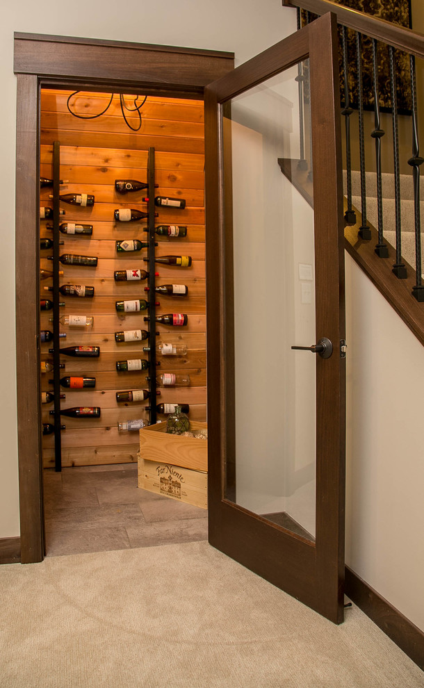 Inspiration for a transitional carpeted wine cellar remodel in Minneapolis