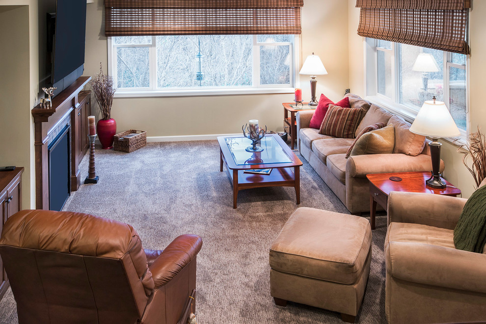 Mid-sized transitional walk-out carpeted and brown floor basement photo in Minneapolis with beige walls, a standard fireplace and a wood fireplace surround