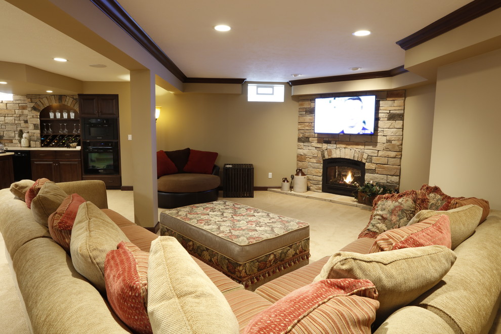 Inspiration for a large fully buried basement in Cleveland with beige walls, carpet, a corner fireplace, a stone fireplace surround and beige floors.