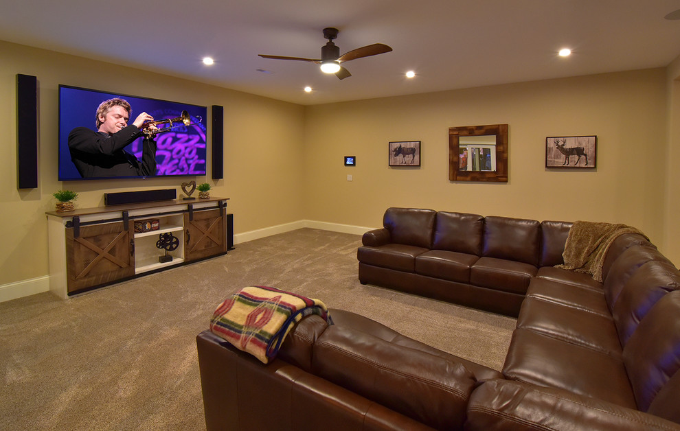 Large arts and crafts carpeted home theater photo in Cleveland
