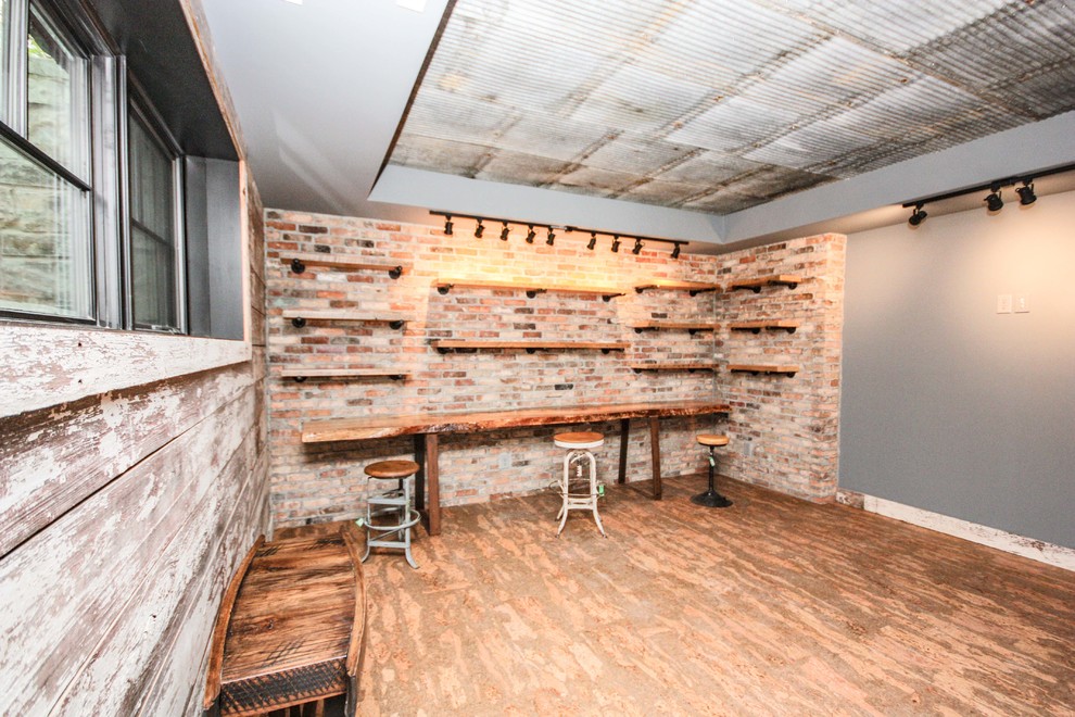 Basement - large country look-out painted wood floor and red floor basement idea in Indianapolis with beige walls and no fireplace