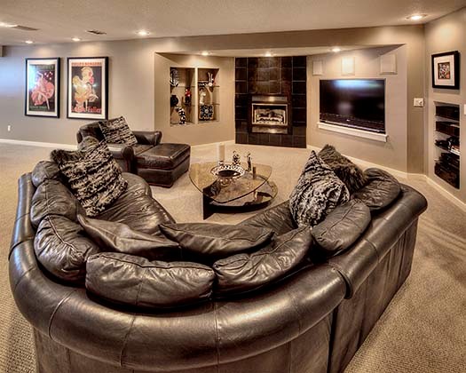 Example of a transitional look-out carpeted basement design in Kansas City with beige walls and a stone fireplace