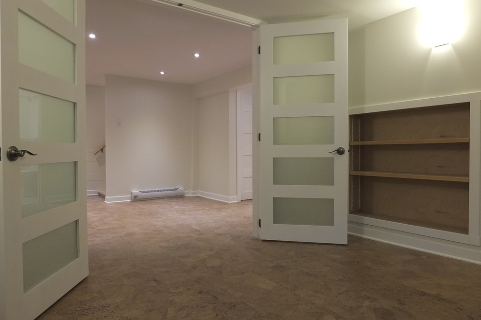 Design ideas for a small retro basement in Montreal with grey walls, cork flooring and brown floors.