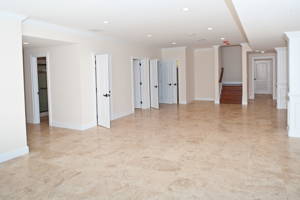 Inspiration for a huge transitional walk-out marble floor basement remodel in DC Metro with beige walls