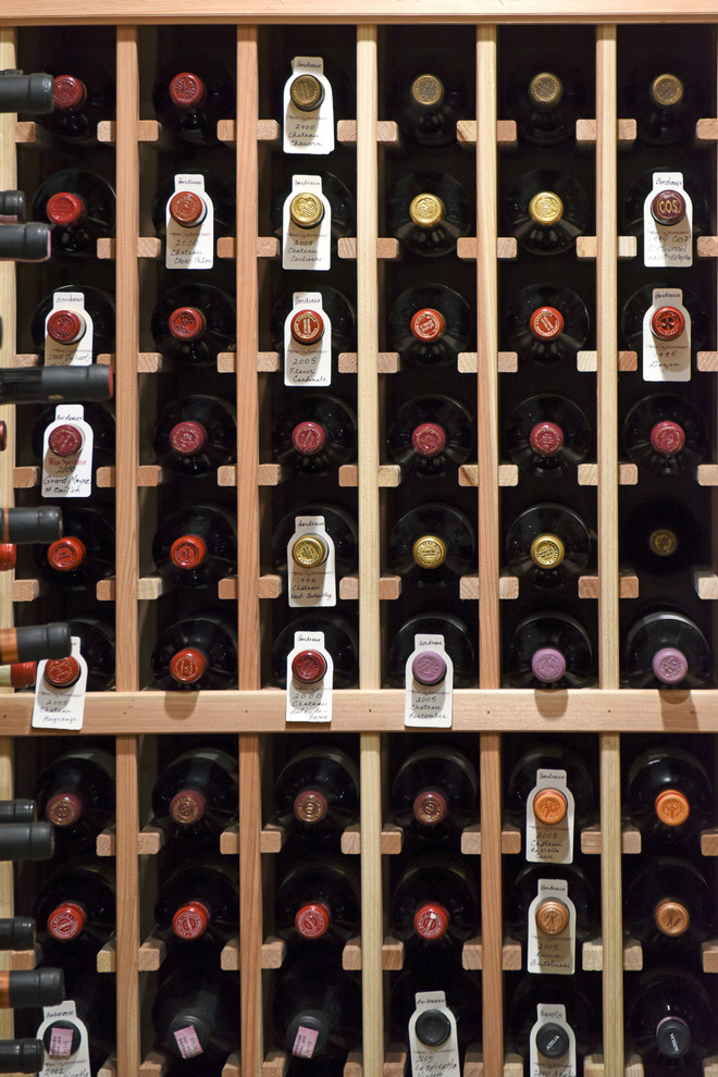 This is an example of a medium sized mediterranean wine cellar in Other.
