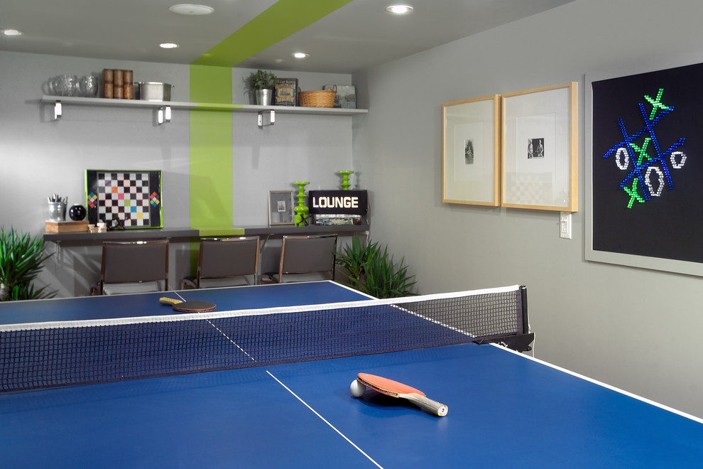 Trendy underground basement photo in Toronto with gray walls