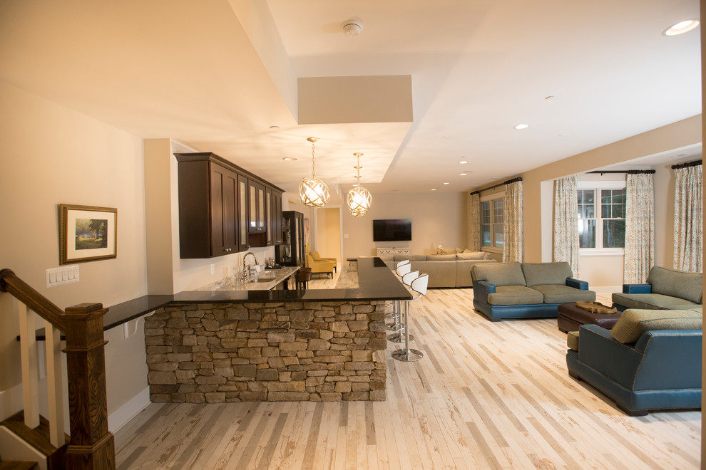 Inspiration for an expansive traditional walk-out basement in Baltimore with beige walls, light hardwood flooring, no fireplace and beige floors.