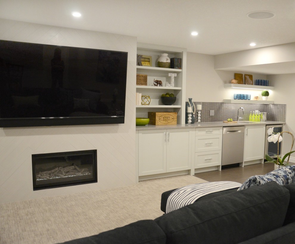 This is an example of a medium sized contemporary fully buried basement in Calgary with grey walls, carpet, a ribbon fireplace, a tiled fireplace surround and grey floors.