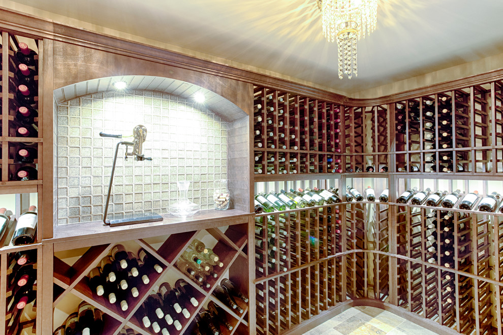 Huge elegant carpeted wine cellar photo in Philadelphia