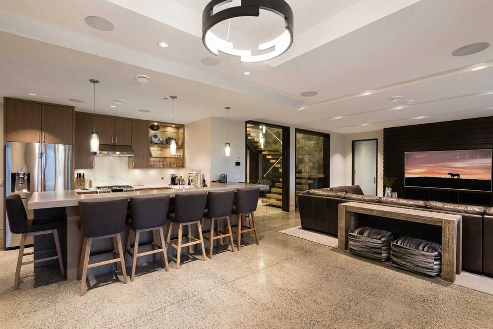 Inspiration for an expansive classic walk-out basement in Vancouver with white walls, concrete flooring, a standard fireplace, a brick fireplace surround and grey floors.