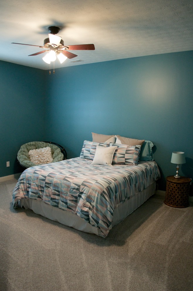 Example of a large transitional look-out carpeted basement design in Indianapolis with blue walls and no fireplace