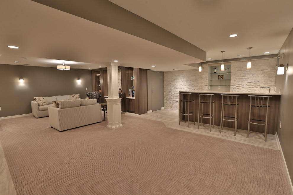 Large trendy underground carpeted basement photo in Philadelphia with beige walls