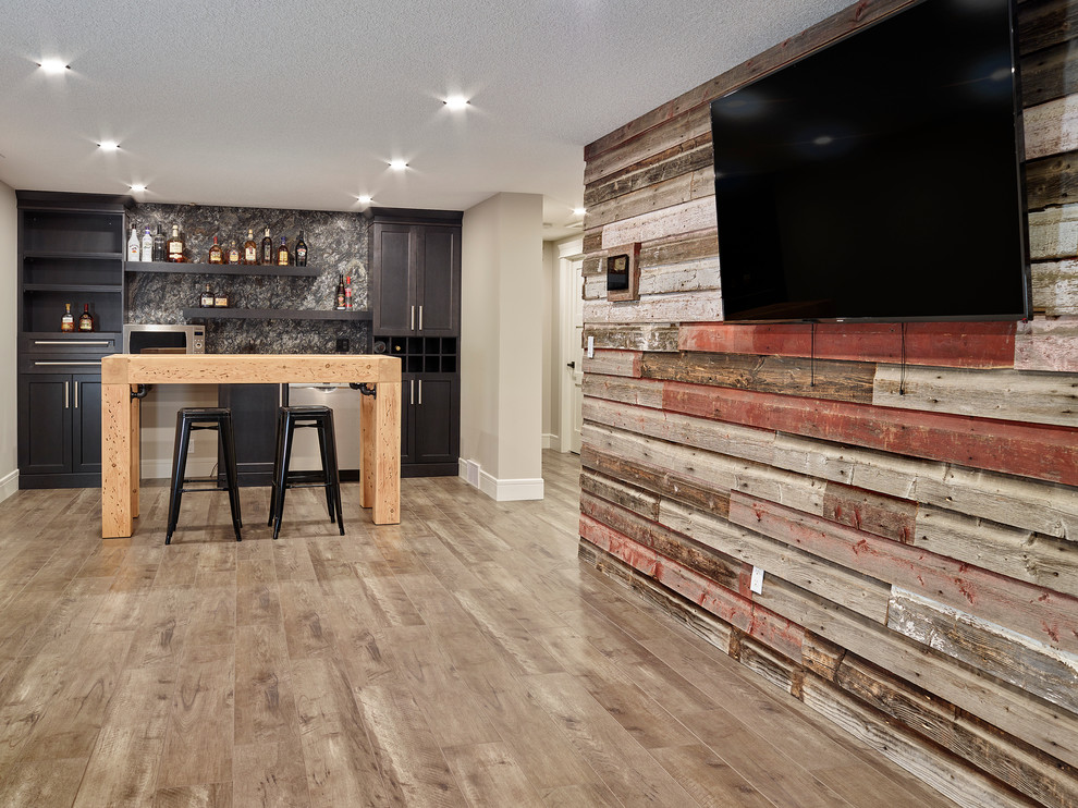 Medium sized rustic walk-out basement in Vancouver with multi-coloured walls.