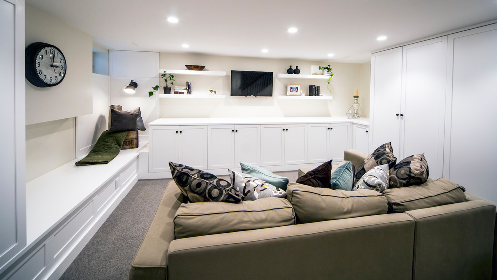 Photo of a small traditional look-out basement in Ottawa with beige walls, carpet and grey floors.