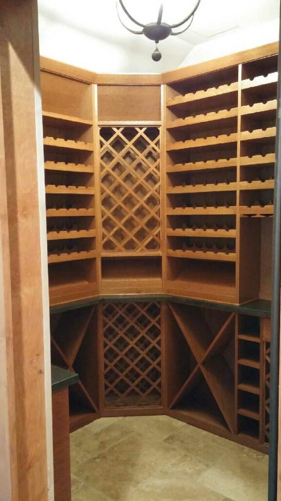Inspiration for a medium sized classic wine cellar in Denver with ceramic flooring.