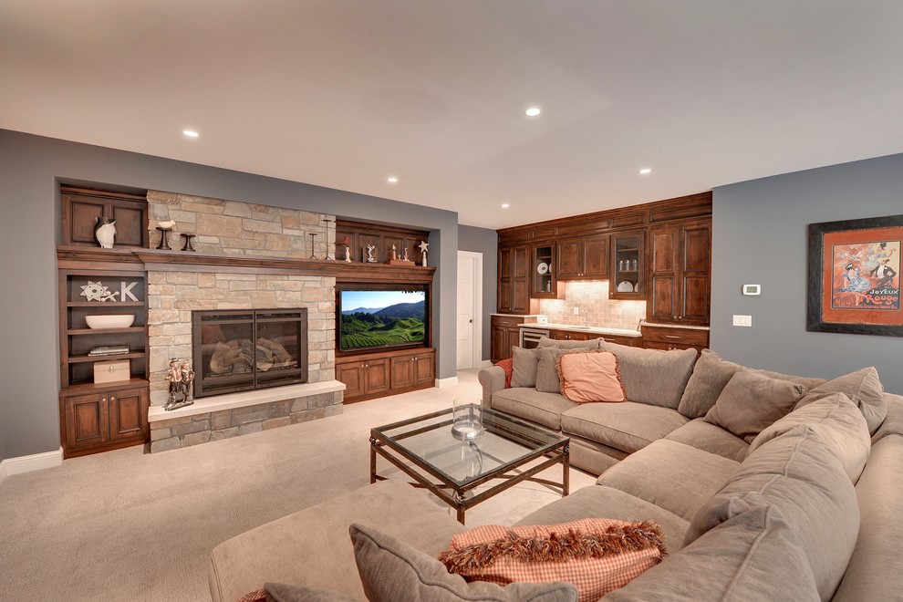 Elegant walk-out carpeted basement photo in Minneapolis with gray walls, a standard fireplace and a stone fireplace