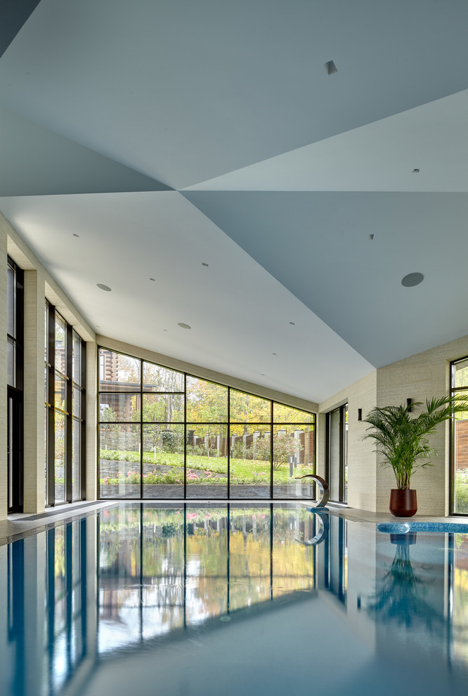 Inspiration for a contemporary indoor custom shaped swimming pool in Moscow.