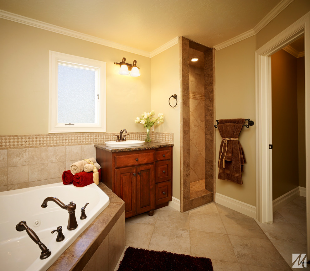 Mid-sized elegant master beige tile and ceramic tile ceramic tile bathroom photo in Salt Lake City with a drop-in sink, raised-panel cabinets, dark wood cabinets, granite countertops and yellow walls