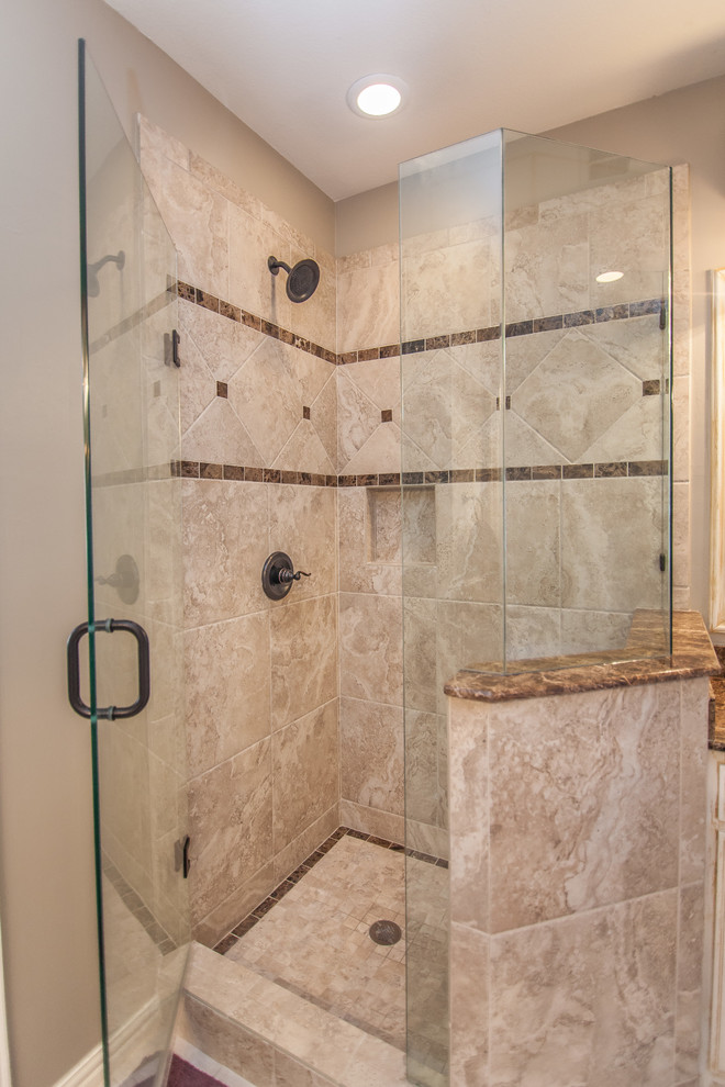 This is an example of a large rustic ensuite bathroom in Dallas with a submerged sink, distressed cabinets, granite worktops, a corner shower, beige tiles and beige walls.