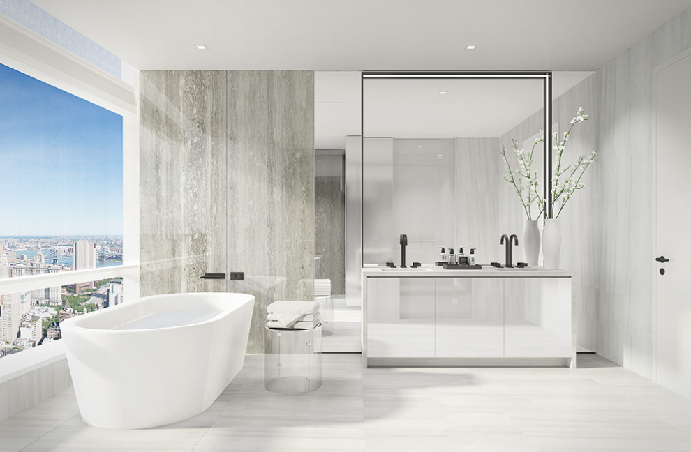 Design ideas for a large modern bathroom in New York with flat-panel cabinets, white cabinets, a freestanding bath, an alcove shower, marble flooring, a submerged sink, marble worktops, white floors, a hinged door and white worktops.