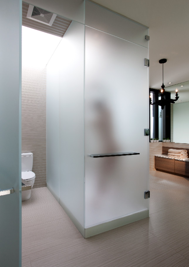 Photo of a large contemporary ensuite bathroom in Calgary with a submerged sink, flat-panel cabinets, medium wood cabinets, an alcove bath, an alcove shower, a one-piece toilet, beige tiles, porcelain tiles, white walls and porcelain flooring.