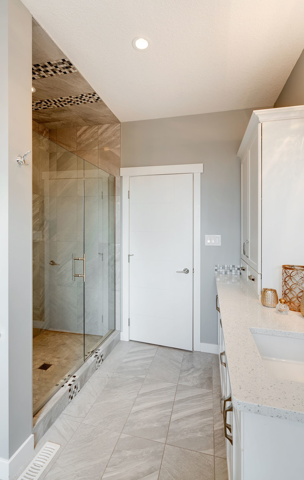 Medium sized classic family bathroom in Calgary with shaker cabinets, white cabinets, an alcove shower, a one-piece toilet, multi-coloured tiles, grey walls, a submerged sink and engineered stone worktops.