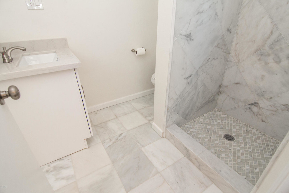 Bathroom - small 1950s master white tile and glass tile mosaic tile floor and multicolored floor bathroom idea in Phoenix with shaker cabinets, white cabinets, a one-piece toilet, white walls, a drop-in sink and quartz countertops