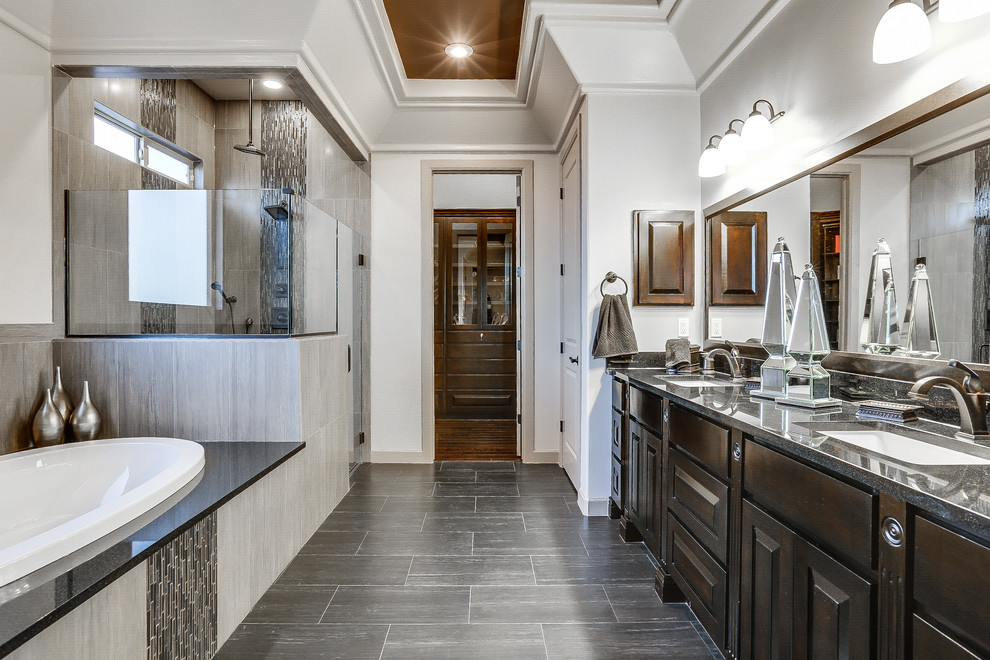 Mid-sized transitional master black tile and matchstick tile porcelain tile bathroom photo in Austin with raised-panel cabinets, dark wood cabinets, white walls, an undermount sink and granite countertops