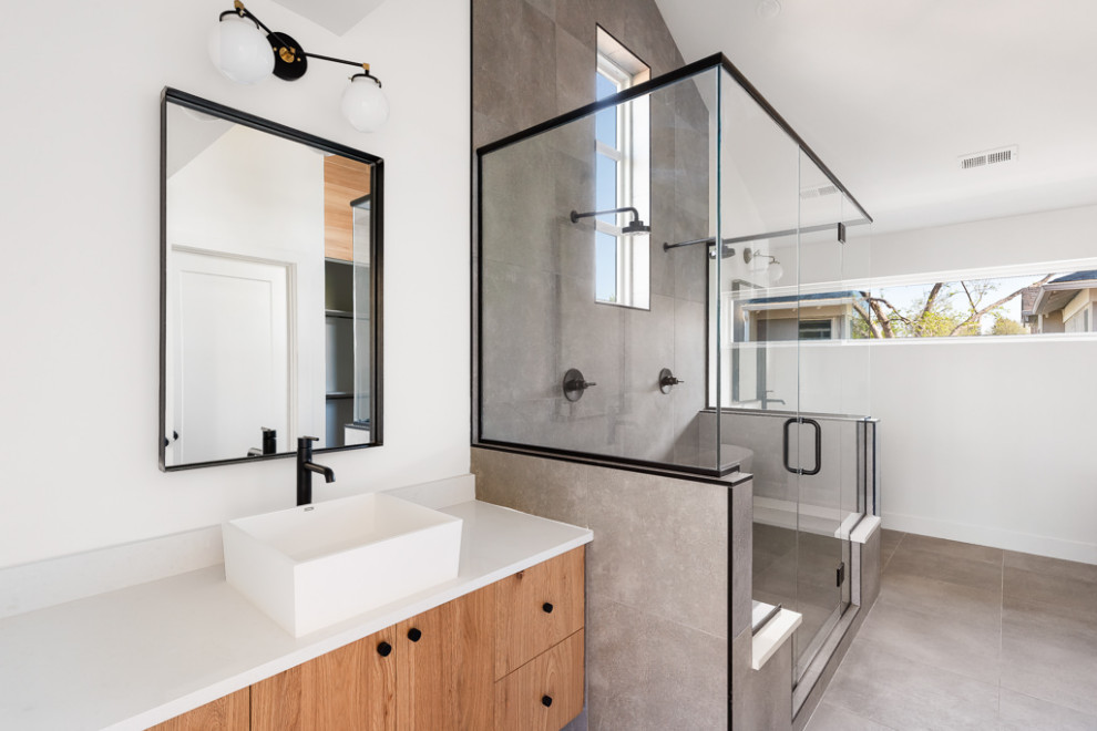 Minimalist master gray tile and cement tile porcelain tile, gray floor and double-sink bathroom photo in Denver with flat-panel cabinets, medium tone wood cabinets, gray walls, an undermount sink, quartzite countertops, a hinged shower door, white countertops and a floating vanity