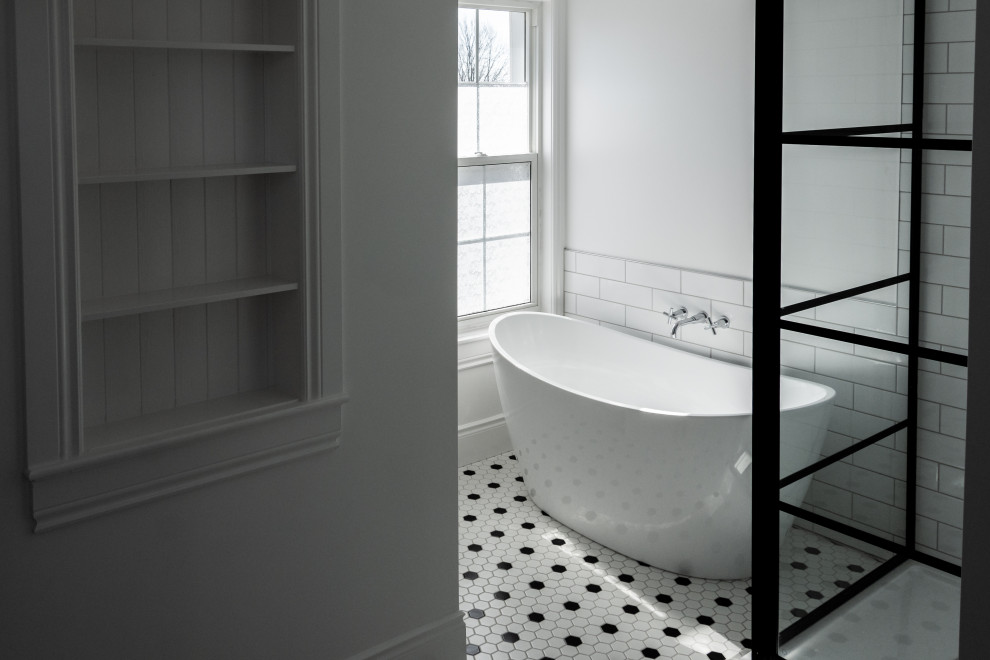 Inspiration for a medium sized contemporary bathroom in Toronto with freestanding cabinets, medium wood cabinets, a freestanding bath, a corner shower, a two-piece toilet, white tiles, metro tiles, white walls, mosaic tile flooring, a submerged sink, multi-coloured floors, a hinged door and brown worktops.