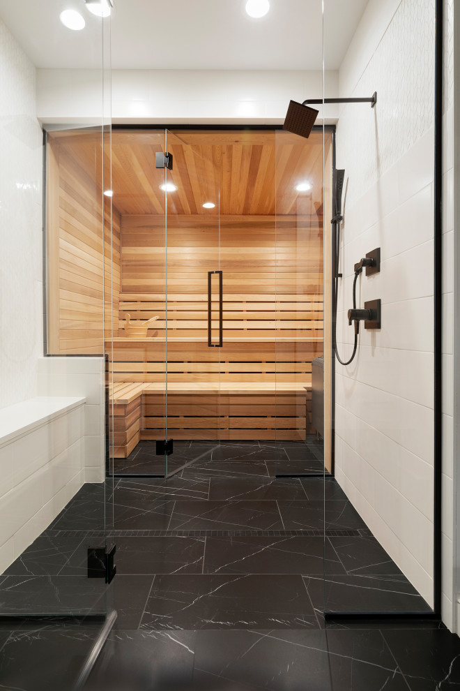 Photo of a medium sized sauna bathroom in Minneapolis with a walk-in shower, white tiles, ceramic tiles, ceramic flooring, black floors, a hinged door and a shower bench.