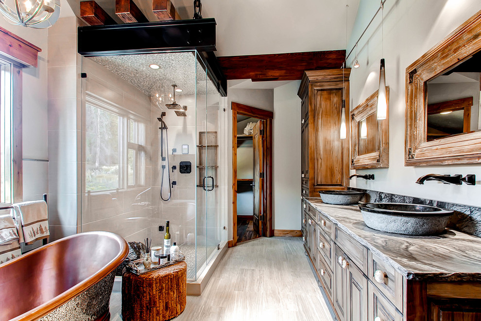 Rustic bathroom in Denver with a console sink and a freestanding bath.