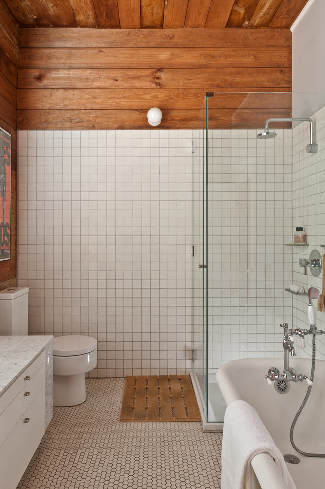 Small contemporary ensuite bathroom in Austin with flat-panel cabinets, white cabinets, marble worktops, a claw-foot bath, a corner shower, a one-piece toilet, white tiles, ceramic tiles and mosaic tile flooring.