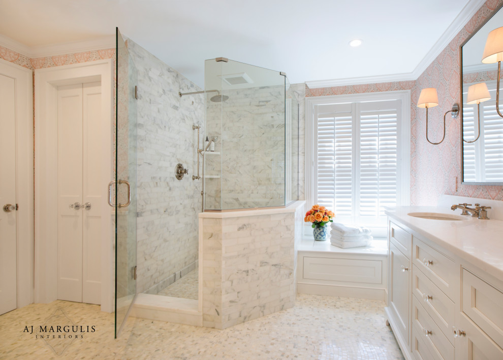 This is an example of a large classic ensuite bathroom in Philadelphia with beaded cabinets, white cabinets, a freestanding bath, a walk-in shower, a two-piece toilet, white tiles, marble tiles, pink walls, marble flooring, a submerged sink, quartz worktops, grey floors, a hinged door and white worktops.
