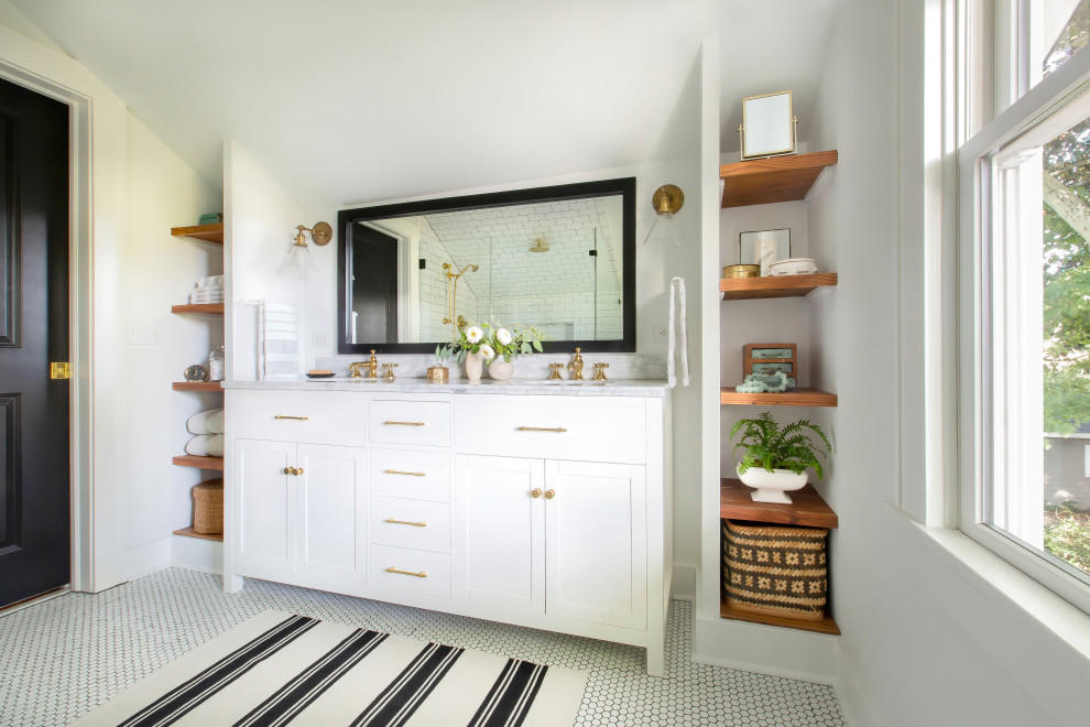 Classic ensuite bathroom in Atlanta with shaker cabinets, white cabinets, a double shower, a two-piece toilet, white tiles, porcelain tiles, white walls, a submerged sink, marble worktops, white floors, a hinged door, grey worktops, double sinks, a freestanding vanity unit and mosaic tile flooring.