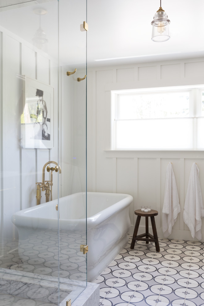 Transitional master ceramic tile and blue tile ceramic tile freestanding bathtub photo in San Francisco with recessed-panel cabinets and white walls