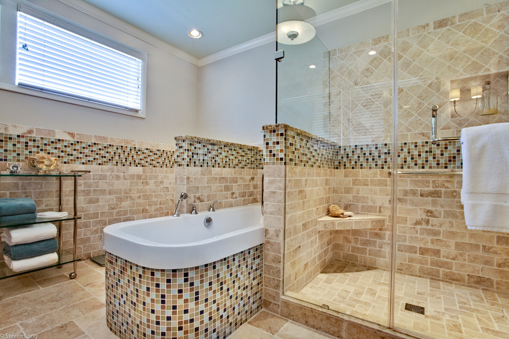 Inspiration for a contemporary beige tile and stone tile travertine floor bathroom remodel in Nashville with an undermount sink, raised-panel cabinets, light wood cabinets, granite countertops and a two-piece toilet