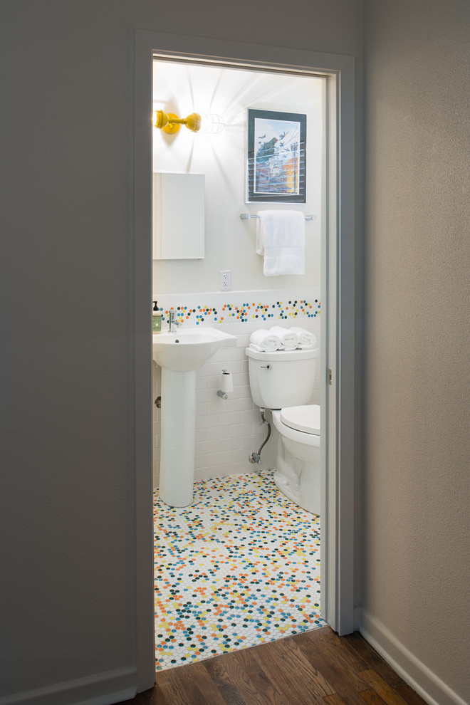 Bathroom - small 1950s 3/4 white tile and subway tile porcelain tile bathroom idea in Austin with a pedestal sink, flat-panel cabinets, white cabinets, a two-piece toilet and white walls