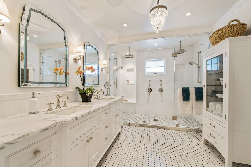 Inspiration for a classic bathroom in Santa Barbara with beaded cabinets, white cabinets, an alcove shower, white tiles, metro tiles, white walls, mosaic tile flooring, a submerged sink, white floors, a hinged door, white worktops, double sinks and a built in vanity unit.