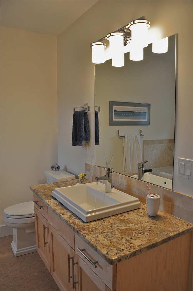 Medium sized contemporary ensuite bathroom in Vancouver with shaker cabinets, light wood cabinets, granite worktops, beige tiles, stone tiles, a one-piece toilet, a built-in sink, beige walls and cork flooring.