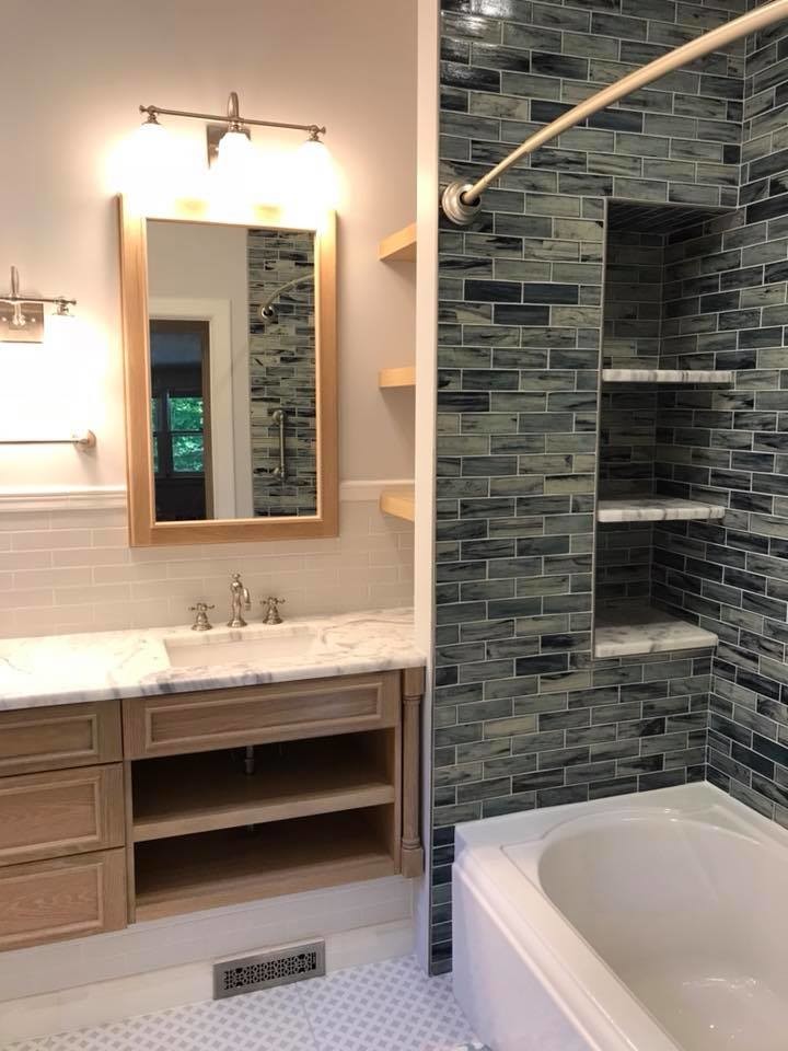 Example of a mid-sized transitional 3/4 gray tile and subway tile porcelain tile and white floor bathroom design in New York with beaded inset cabinets, light wood cabinets, white walls, an undermount sink and marble countertops