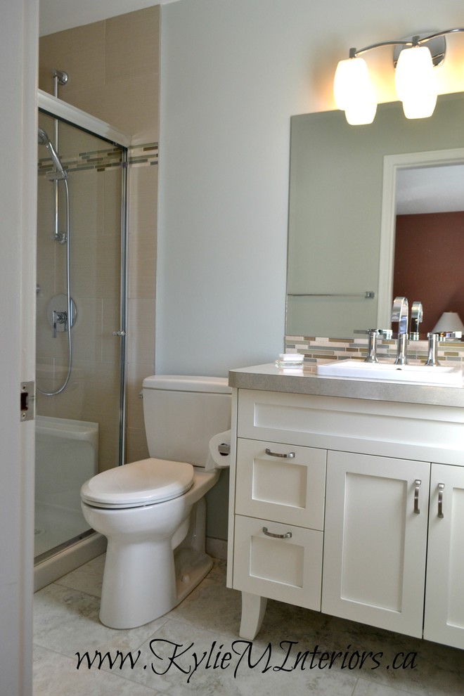 Photo of a small classic shower room bathroom in Vancouver with a built-in sink, shaker cabinets, white cabinets, a walk-in shower, a one-piece toilet, beige tiles, porcelain tiles, blue walls and porcelain flooring.