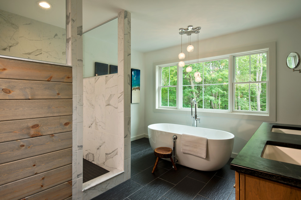 Стильный дизайн: главная ванная комната в стиле модернизм с врезной раковиной, отдельно стоящей ванной, белыми стенами, столешницей из талькохлорита, душем в нише, белой плиткой, керамогранитной плиткой и полом из керамогранита - последний тренд