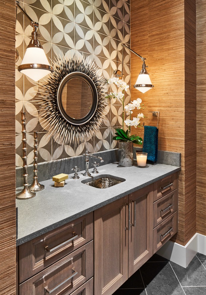 На фото: ванная комната в средиземноморском стиле с фасадами с утопленной филенкой, темными деревянными фасадами, разноцветной плиткой, цементной плиткой, коричневыми стенами, врезной раковиной, серым полом и серой столешницей