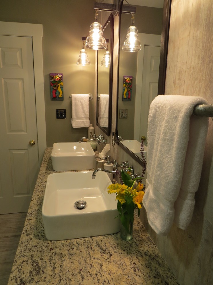 Example of a mid-sized eclectic multicolored tile and porcelain tile porcelain tile tub/shower combo design in Portland Maine with a vessel sink, flat-panel cabinets, medium tone wood cabinets, granite countertops, a wall-mount toilet and gray walls