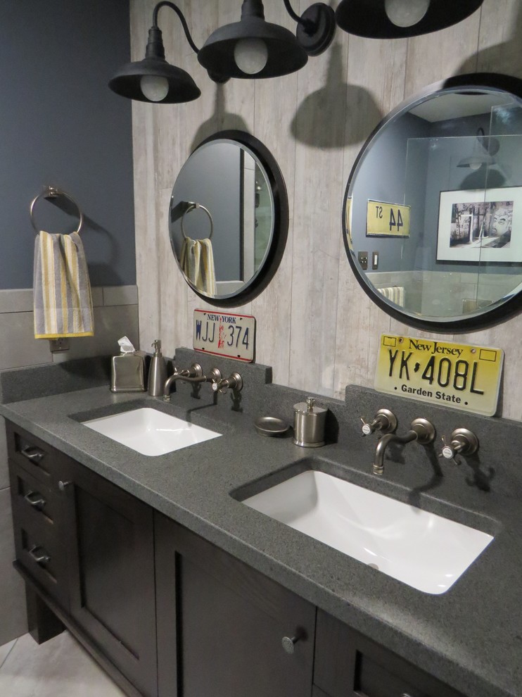 This is an example of a small urban shower room bathroom in Portland Maine with a submerged sink, recessed-panel cabinets, dark wood cabinets, granite worktops, a wall mounted toilet, porcelain tiles, grey walls, porcelain flooring and grey tiles.