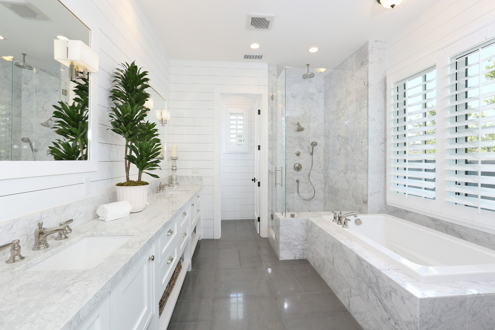 Large transitional master white tile ceramic tile and gray floor bathroom photo in Orange County with an undermount sink, recessed-panel cabinets, white cabinets, marble countertops and white walls