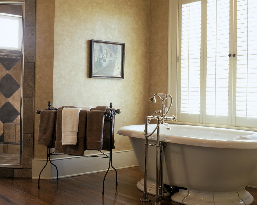 This is an example of a traditional bathroom in Other with a freestanding bath and a corner shower.