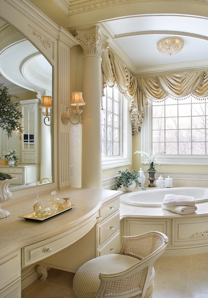 Example of a mid-sized classic limestone floor bathroom design in New York with raised-panel cabinets, white cabinets, limestone countertops, a two-piece toilet and an undermount sink