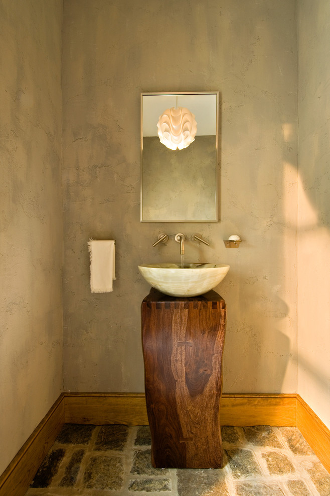Rustic cloakroom in New York with a vessel sink.